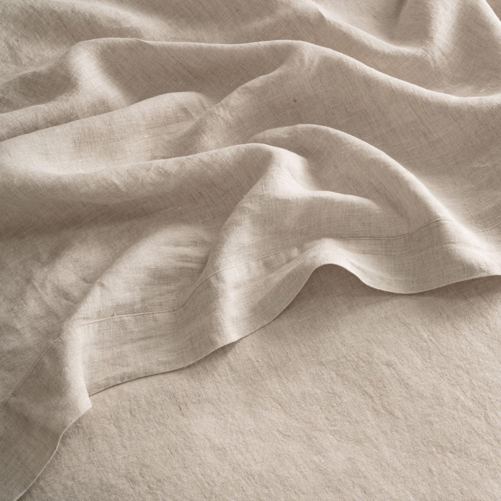 Linen fabric Soft natural linen fabric in muted tones, gently folded — evoking calm, simplicity and the texture of everyday comfort.